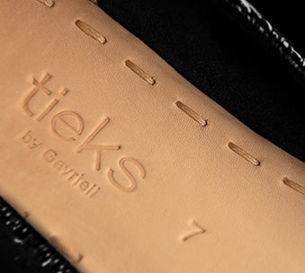 hand-stiched insoles of a pair of tieks ballet flats