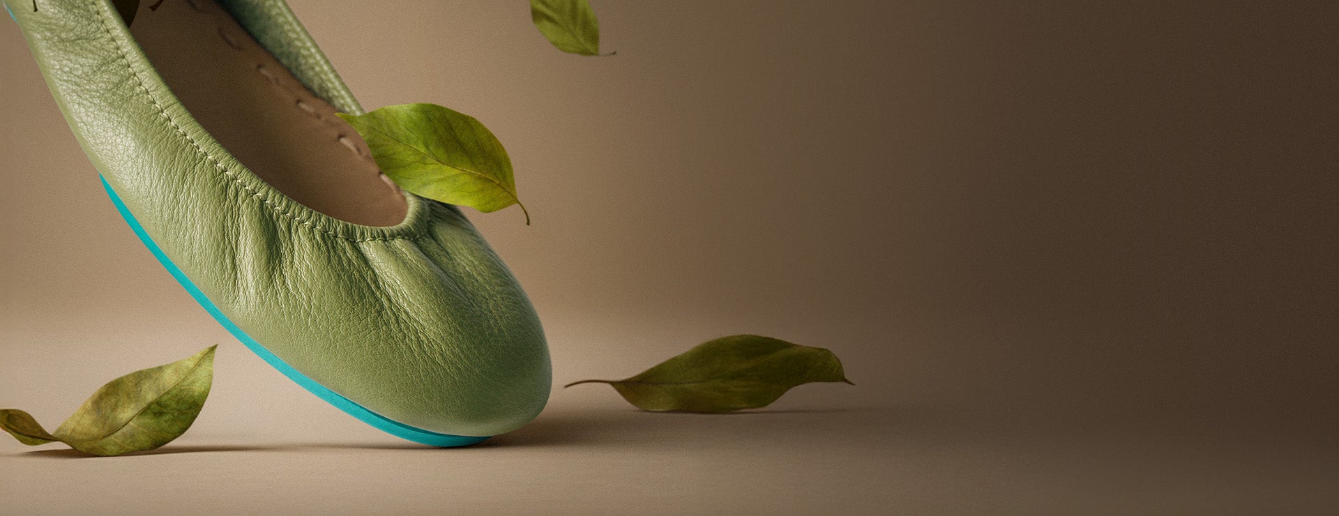 olive tieks ballet flats surrounded by falling leaves