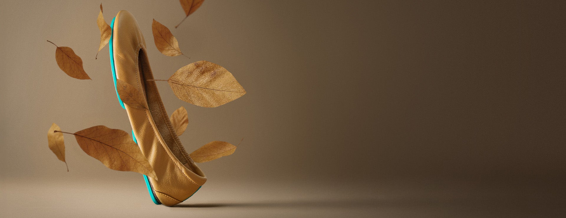 camel tieks ballet flats surrounded by falling leaves