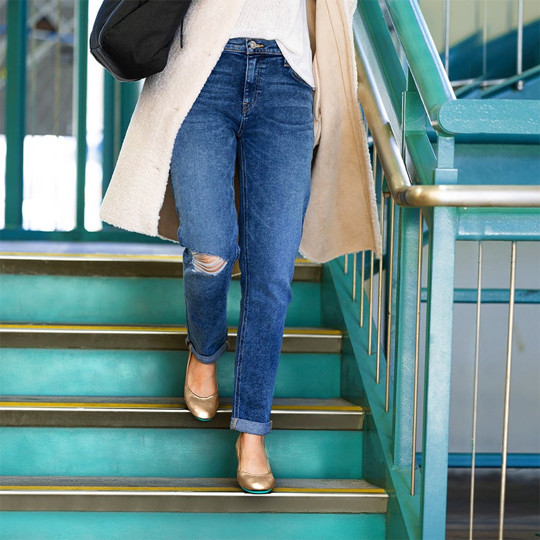 metallic bronze tieks flats styled with a coat for fall