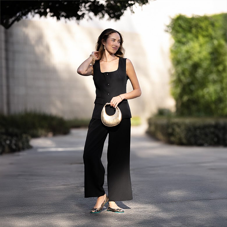 copperhead snake print ballet flats styled with a black top and black wide leg pants