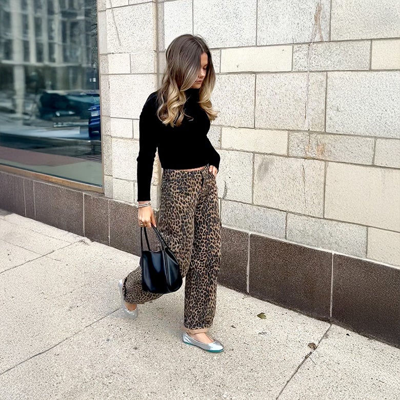 silver tieks ballet flats styled with leopard print pants and a black sweater