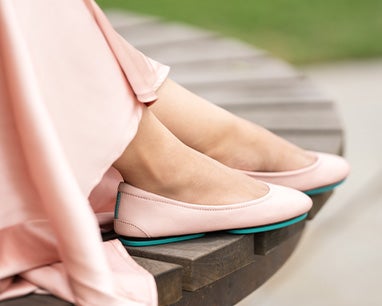 ballerina pink tieks flats styled with a pink skirt
