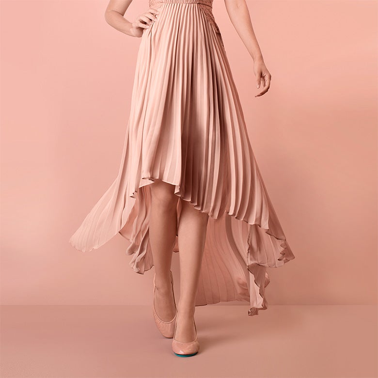 blush patent tieks flats styled with a blush colored dress