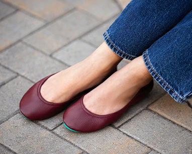 burgundy ballet flats styled with dark denim