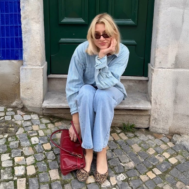woman wearing leopard print tieks flats with an all denim outfit