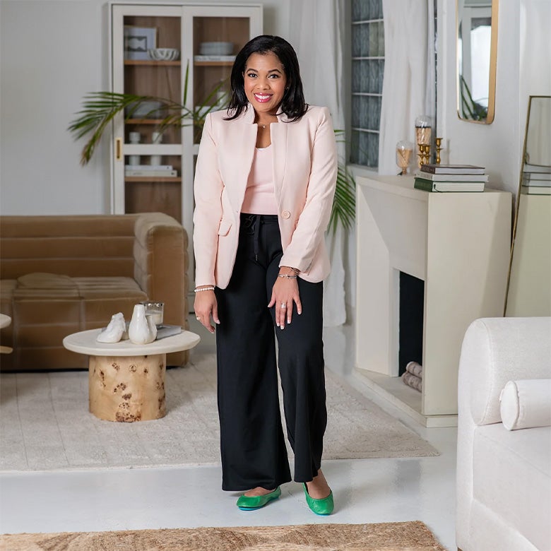 woman wearing clover green flats with her business casual outfit