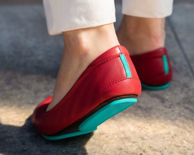 close-up shot of the heel of cardinal red tieks flats