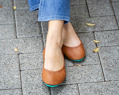 jeans styled with chestnut brown tieks flats