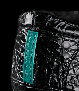 Close up of Tieks ballet flat cushioned heel and signature Tiek Blue stripe.