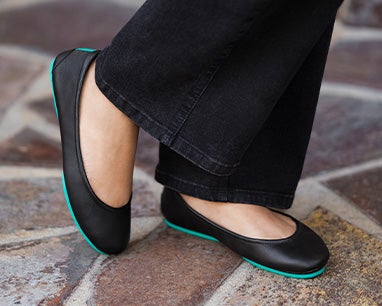 matte black tieks flats paired with black jeans