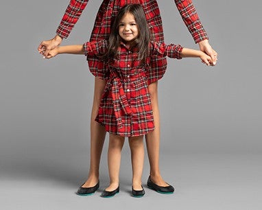 mommy and daughter twinning in plaid dresses and matte black flats