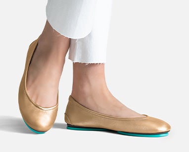social image featuring metallic gold tieks flats