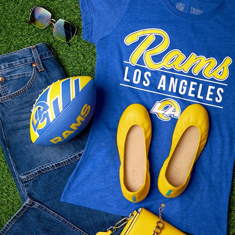 mustard yellow tieks flats styled with a los angeles rams themed outfit