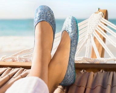 model wearing paradise blue tieks on a hammock