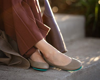 taupe tieks flats paired styled with brown pants