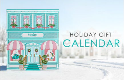 snow-covered, pastel Tiek Blue boutique with pink awnings and holiday decorations